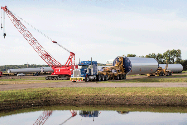 Project Freight Being Loaded Onto Multi-Axle Trailer for Highway Transport 